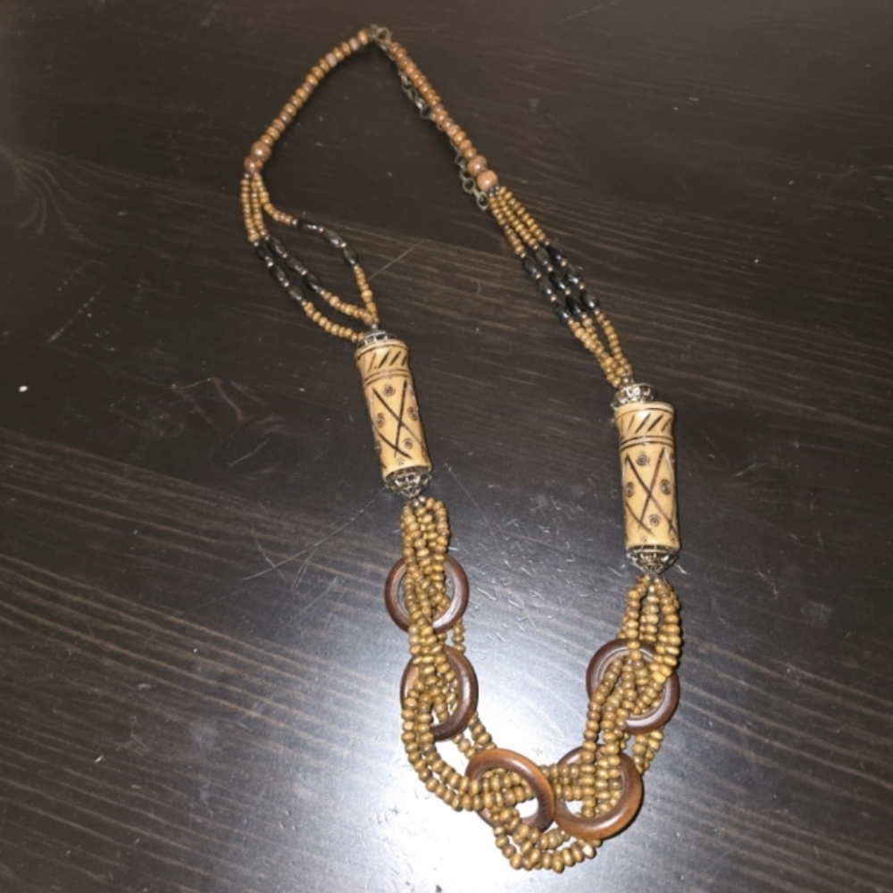 Boho necklace african origine hand carved featuring real bone and wood beads.